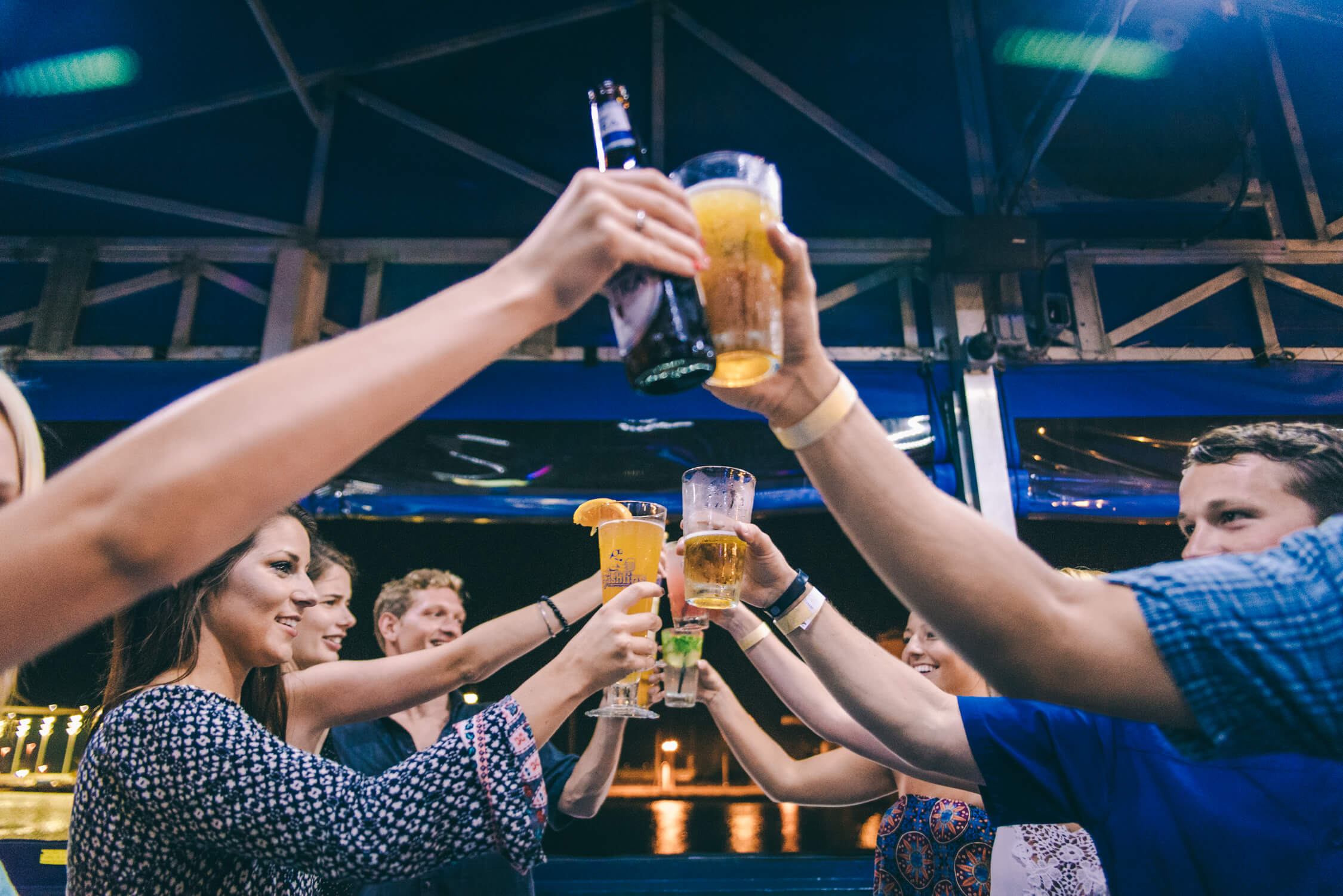 Friends toast at a bar