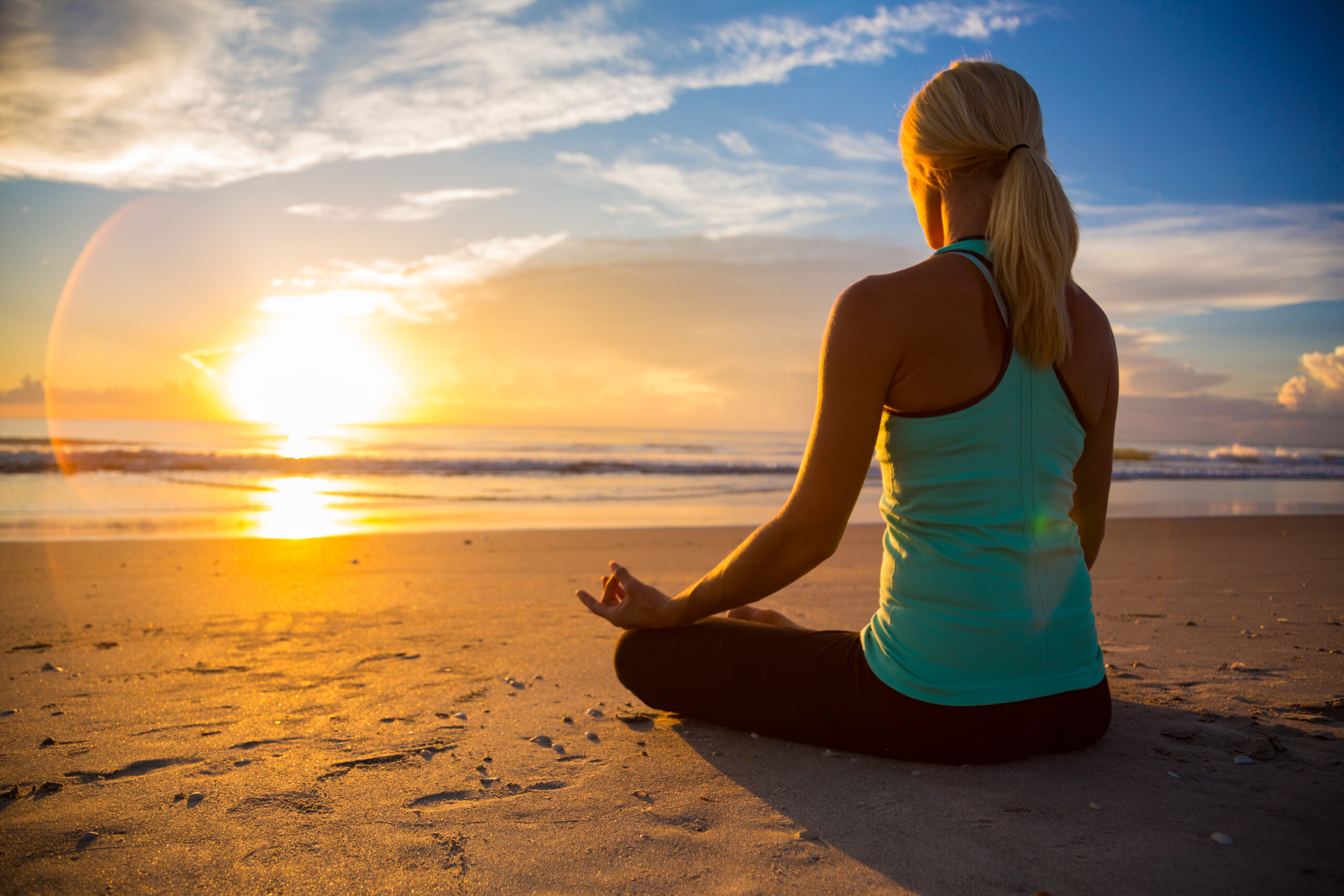 Yoga on the beach at sunrise