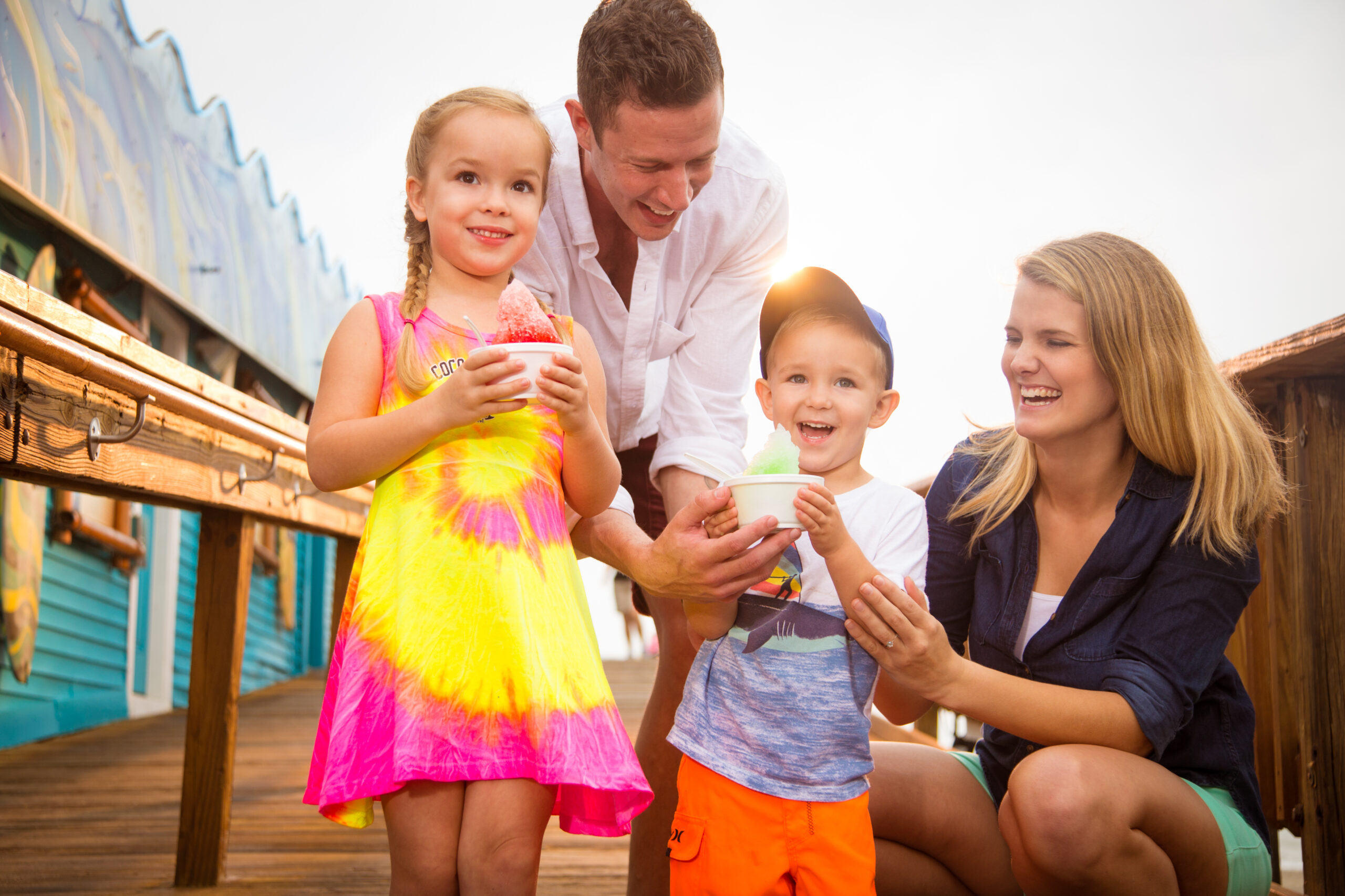 Family eating snow cones at the Westgate Cocoa Beach Pier