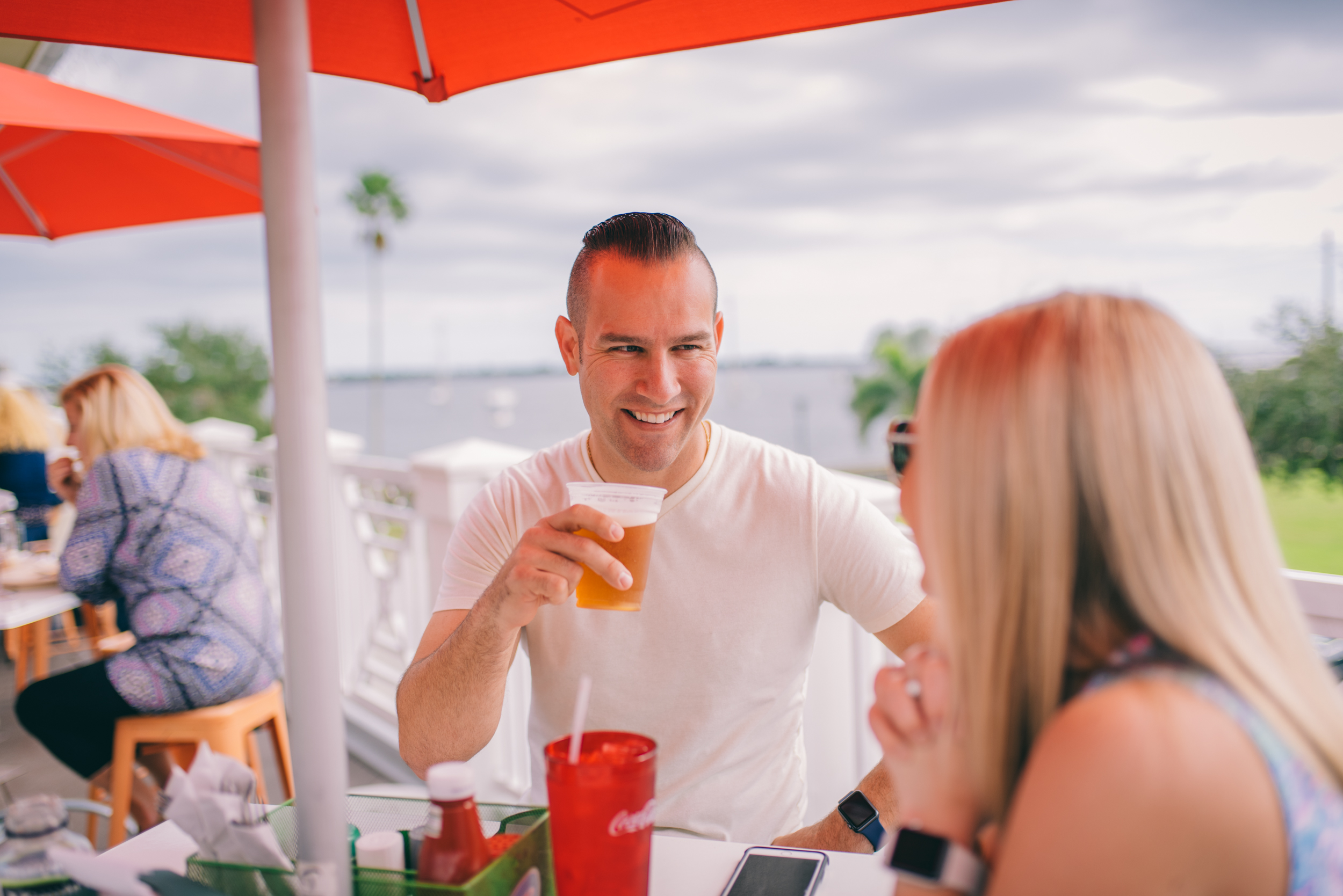 Outdoor dining with waterfront views at Ryan's Pizza in Cocoa Village