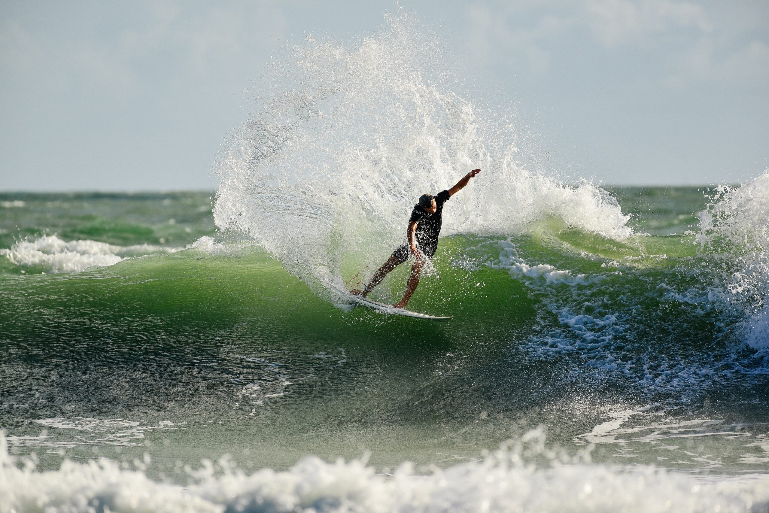 Surfing a wave in Melbourne & the Beaches