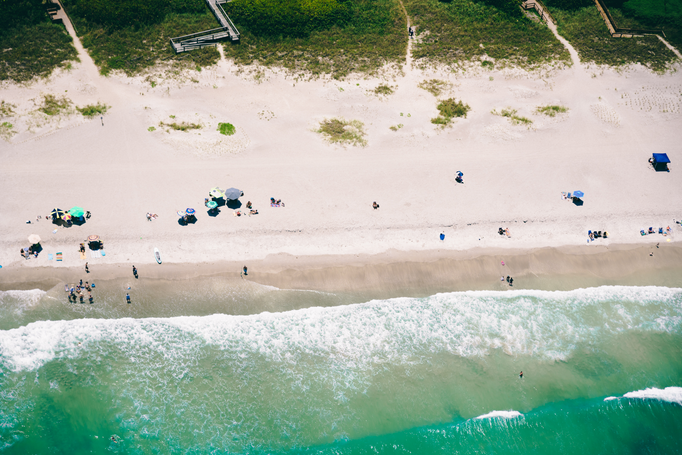 Aerial view of the waves crashing on the beach