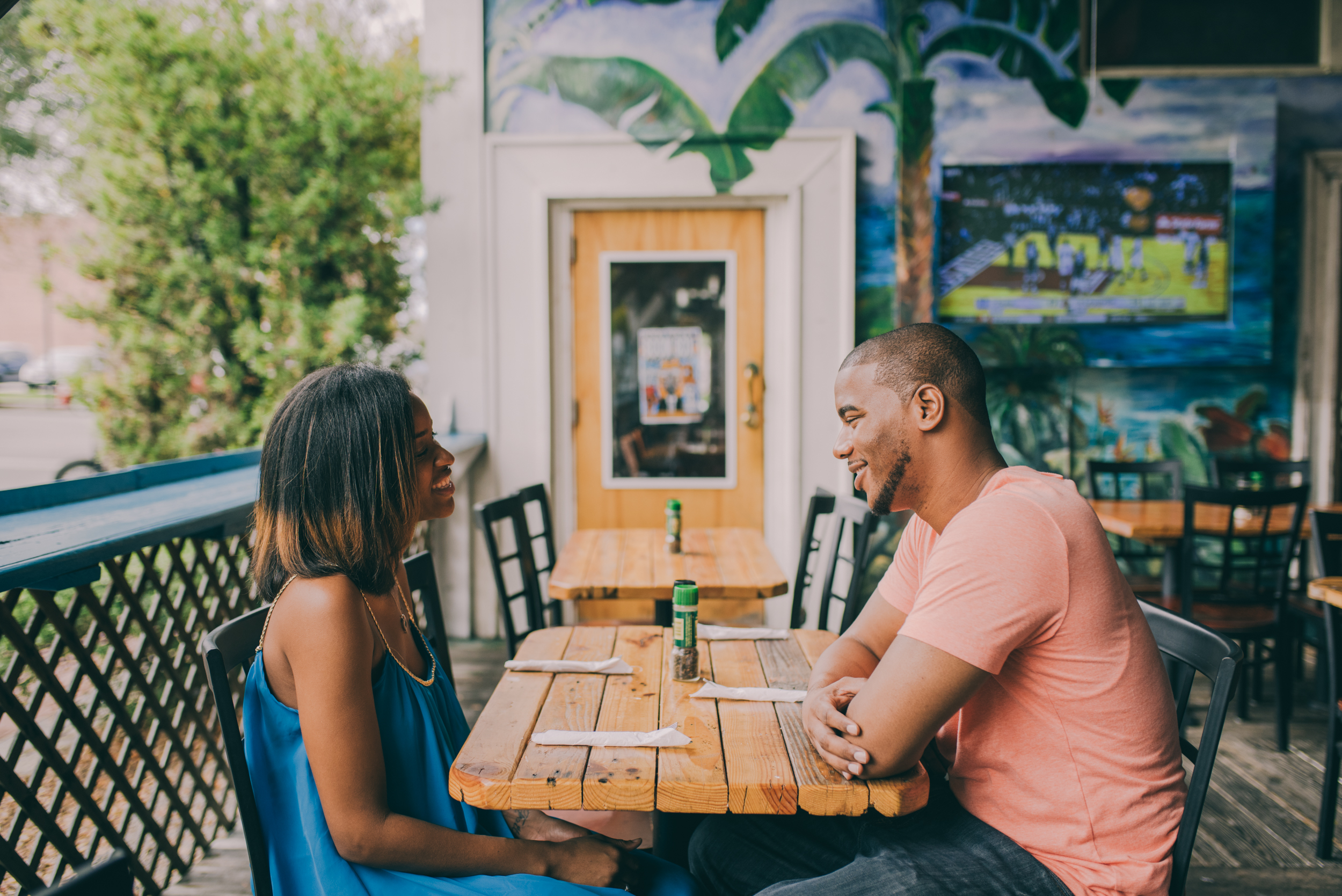 A couple has lunch on an outdoor patio in Cocoa Village
