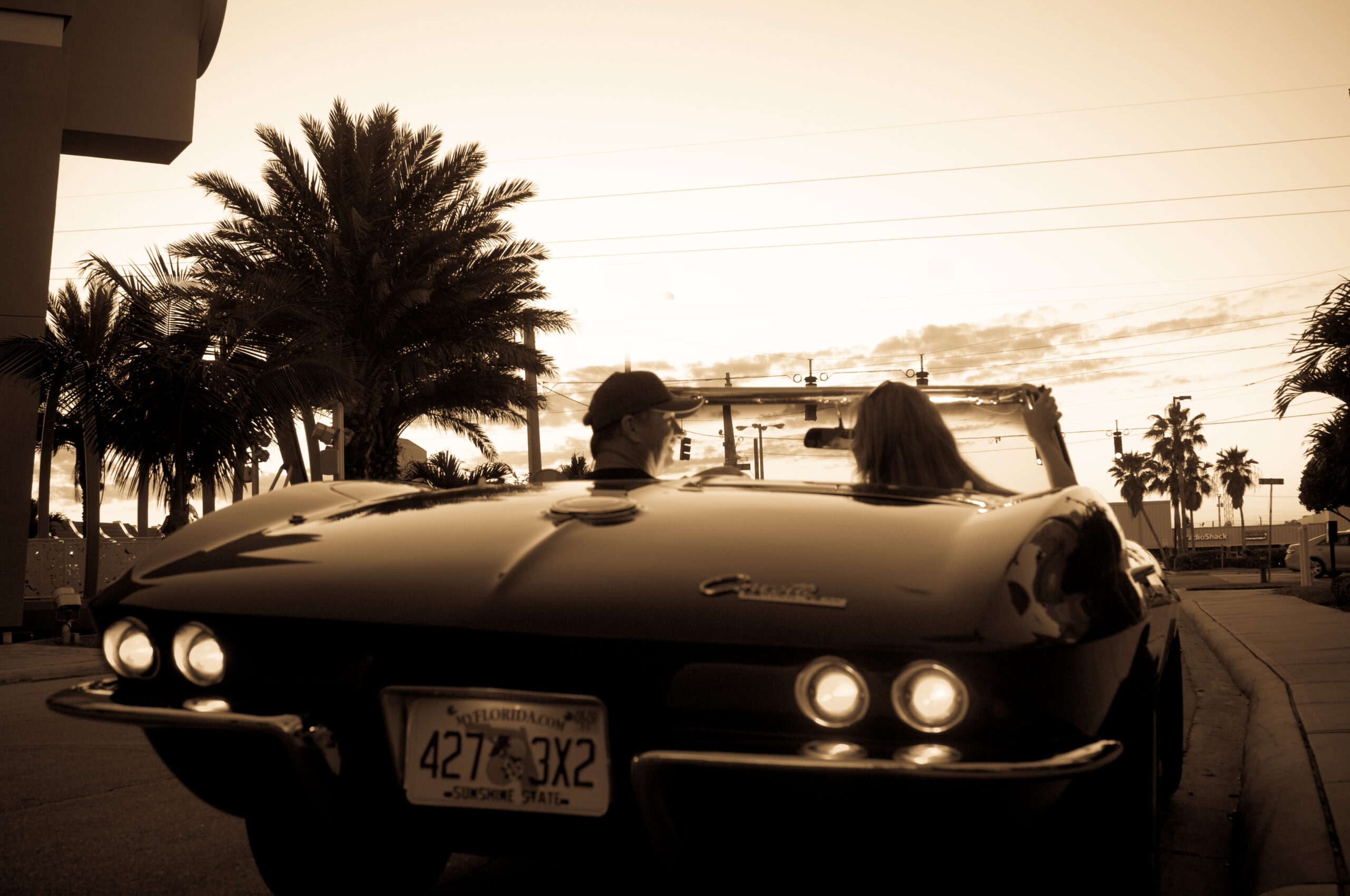 Couple Driving a Corvette on the Space Coast