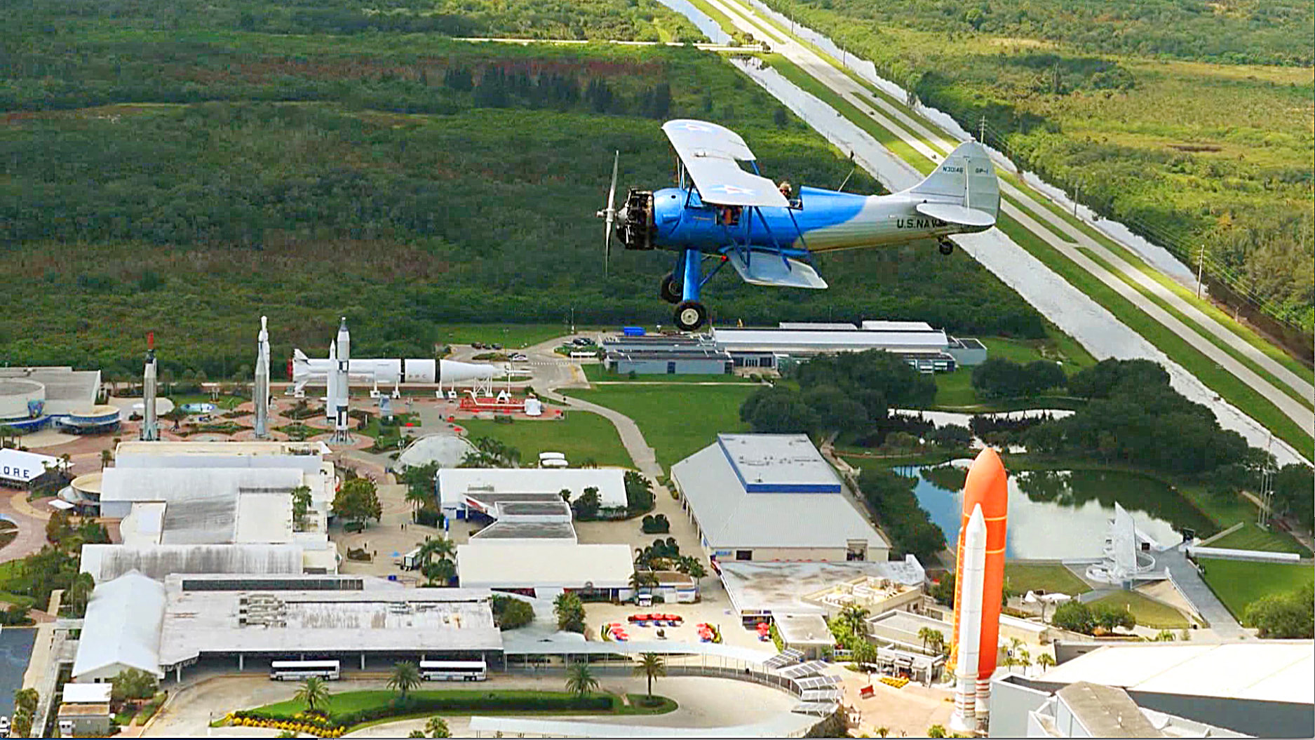 Florida Air Tour Biplane flies over Kennedy Space Center Visitor Complex