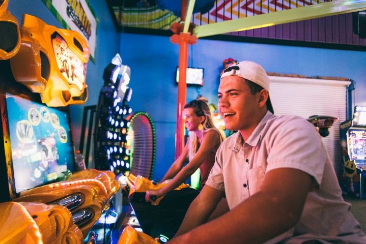 Andretti Thrill Park Guys Playing Arcade Games