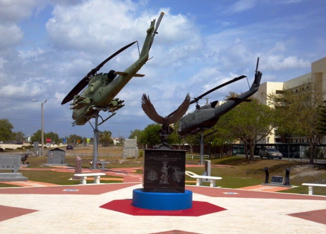 Brevard Veteran's Memorial Center Minutement Plaque with Helicopters in Background