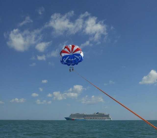 Cocoa Beach Parasail Parasailing with Cruise Ship in Background