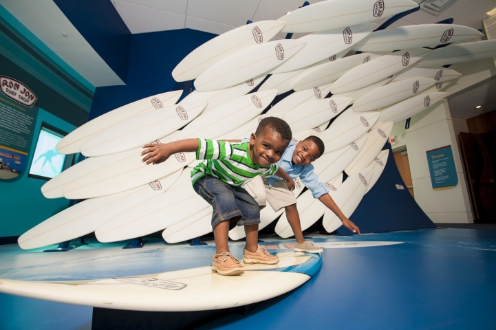 Exploration Tower Kids Playing on Surfboard