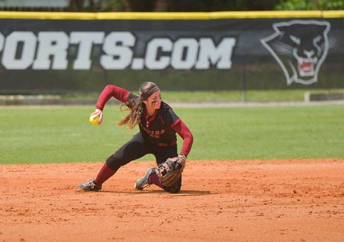 A softball player throwing the ball in a game at the Florida Institute of Technology
