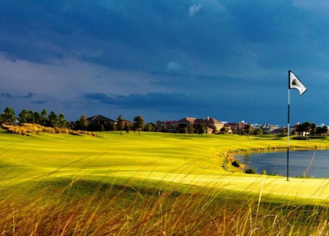 Duran Golf Club Exterior Shot of Greens and Clubhouse in Background