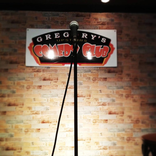 Gregory's Upstairs Comedy Club Logo and mic