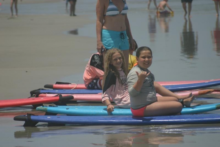 Kids learning how to surf with the School of Surf