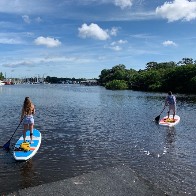 People renting stand-up paddleboards from Ballards Boards in Melbourne, FL