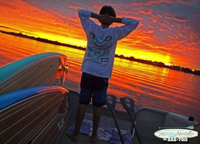 All Water Adventures Kid Watching Sunset from Boat