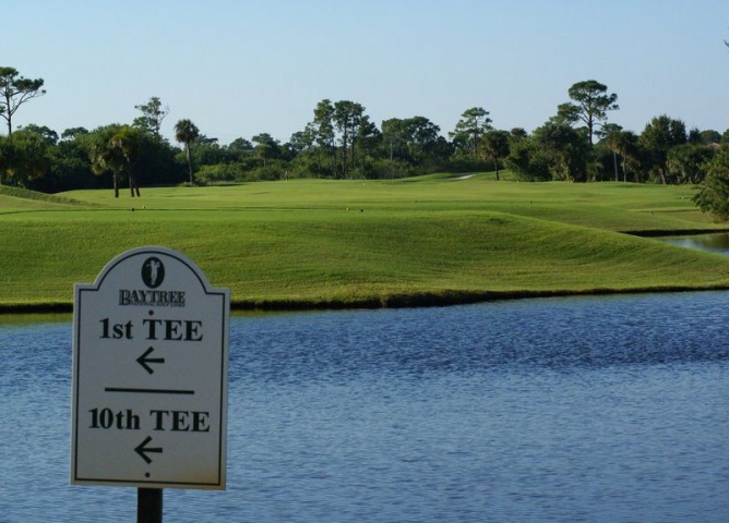 Baytree National Golf Links Direction Sign Near Body of Water