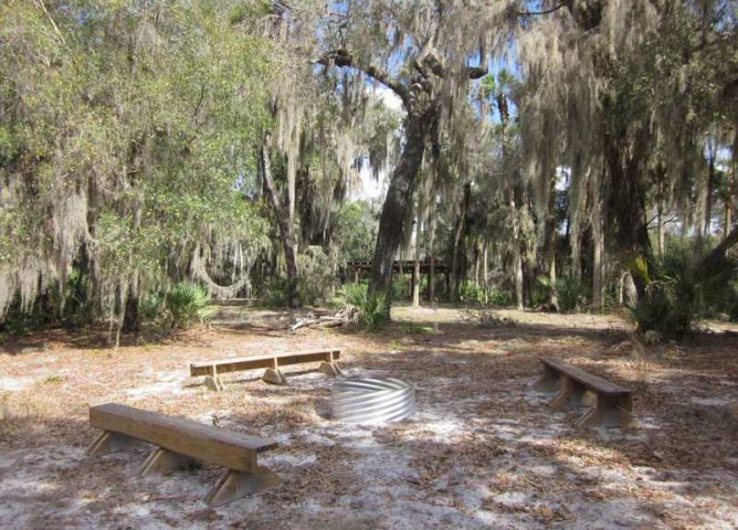 Fox Lake Park Firepit Surrounded by Seating and Treas