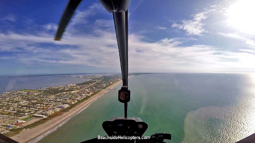 Beachside Helicopters Flying Along Coast