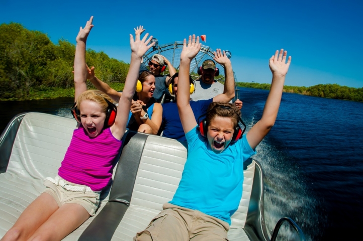 Airboat Rides At Midway Group with Hands up on Airboat