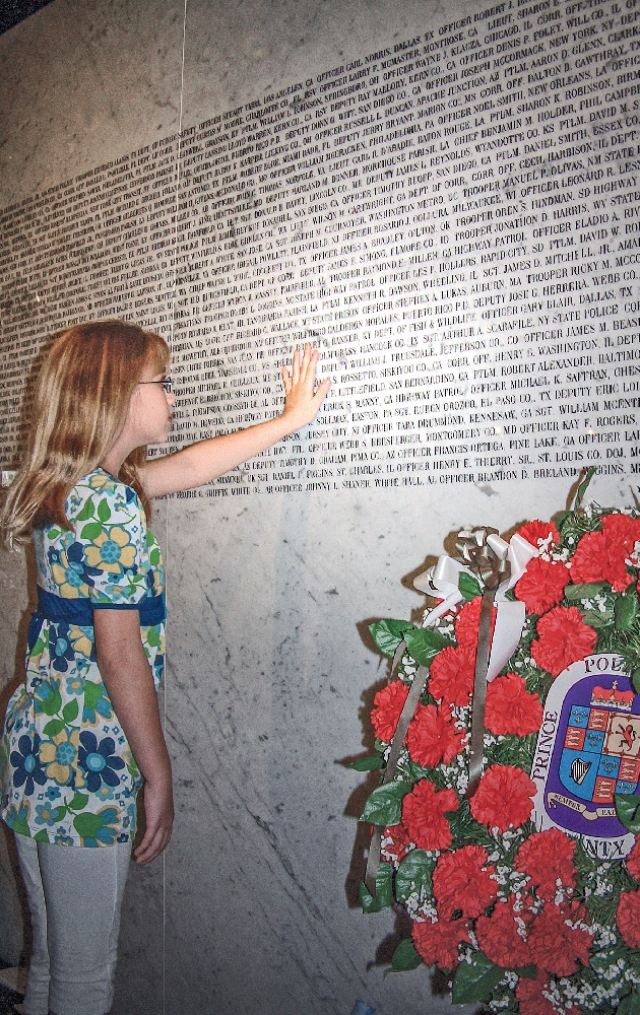 American Police Hall of Fame Child Viewing Names on Wall