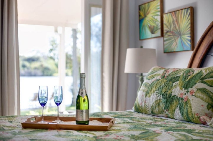 Crane Creek Inn Waterfront Bed & Breakfast Room with Champagne on Bed