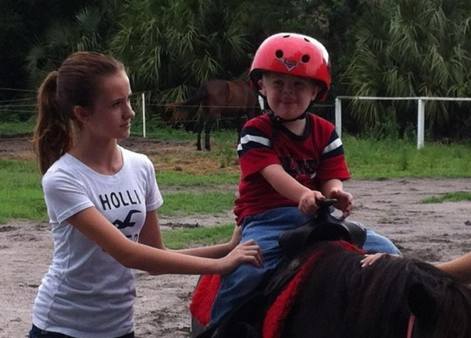 Walk on Water Ministries Kid Riding Pony