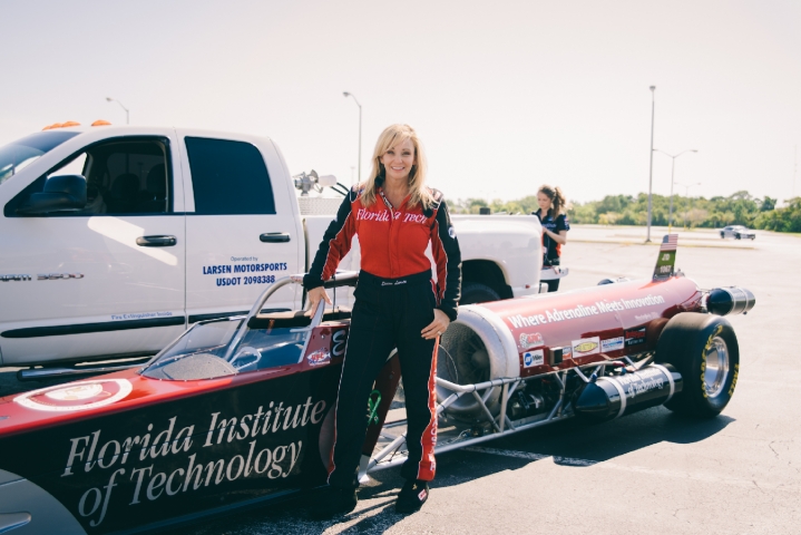 Larsen Motorsports Woman Next to Rocket Car
