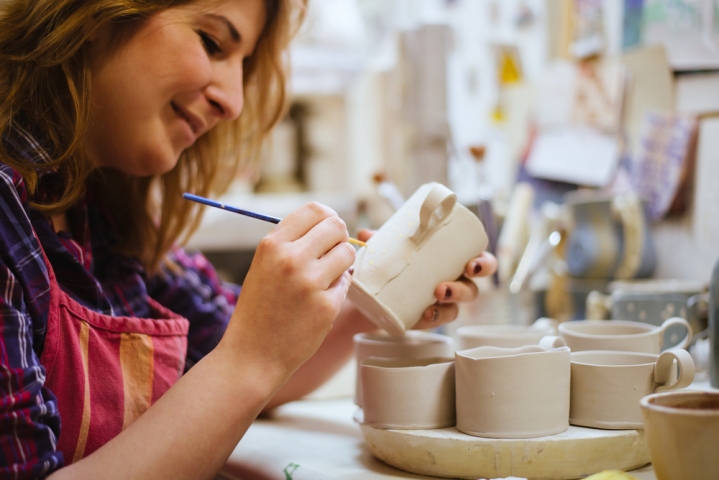 Get Fired Up: Paint Your Own Pottery Studio Woman Painting Mug