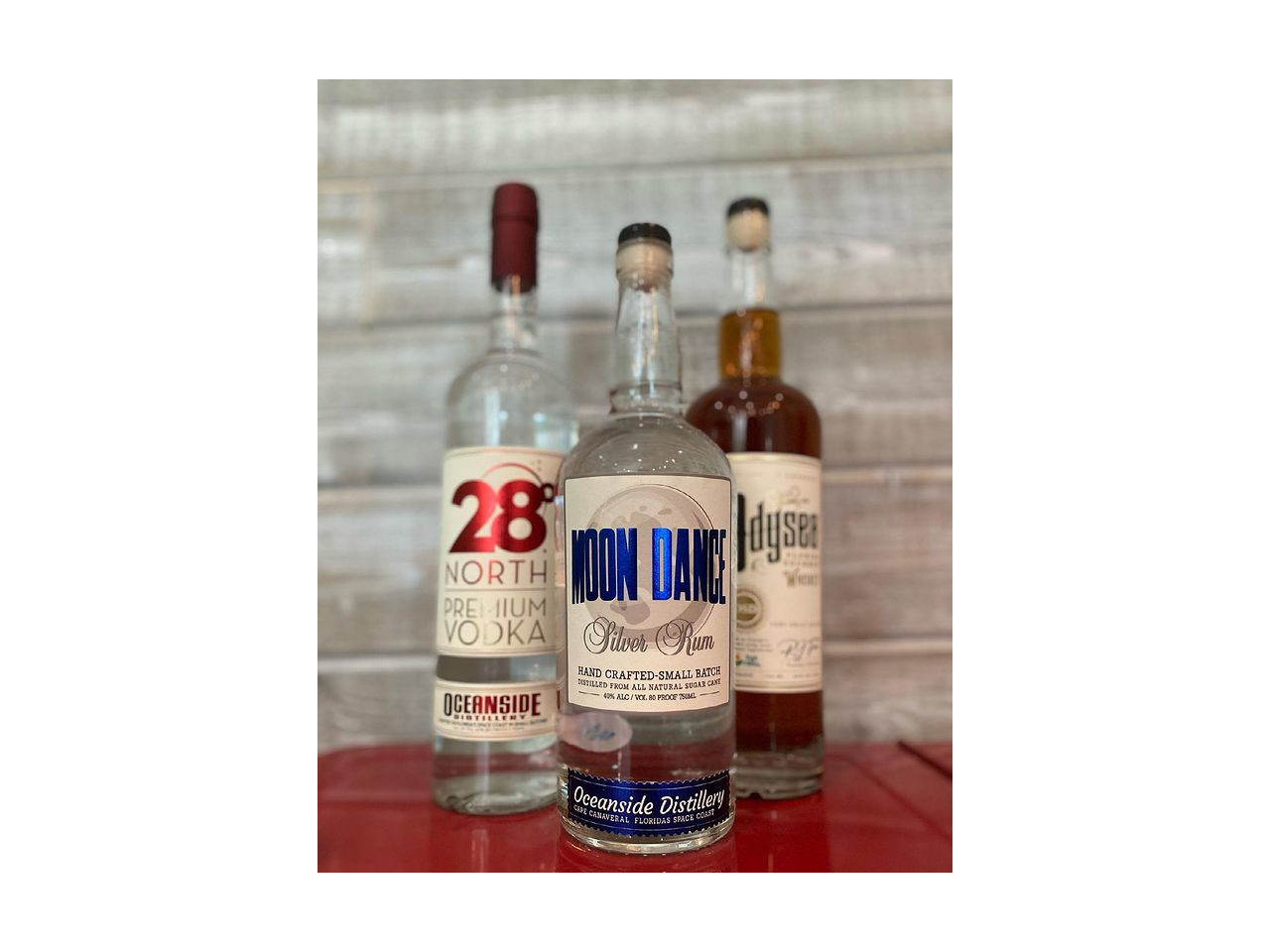 3 bottles of liquor, 28 degree North Vodka, Moon Dance Silver Rum and Odysea  Whiskey