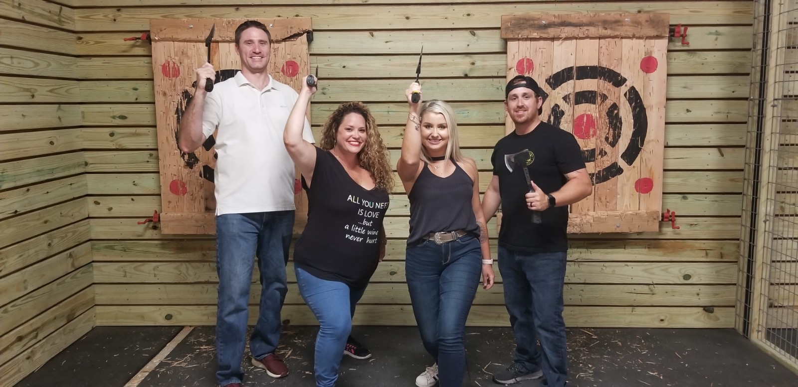 A group posing in front of targets