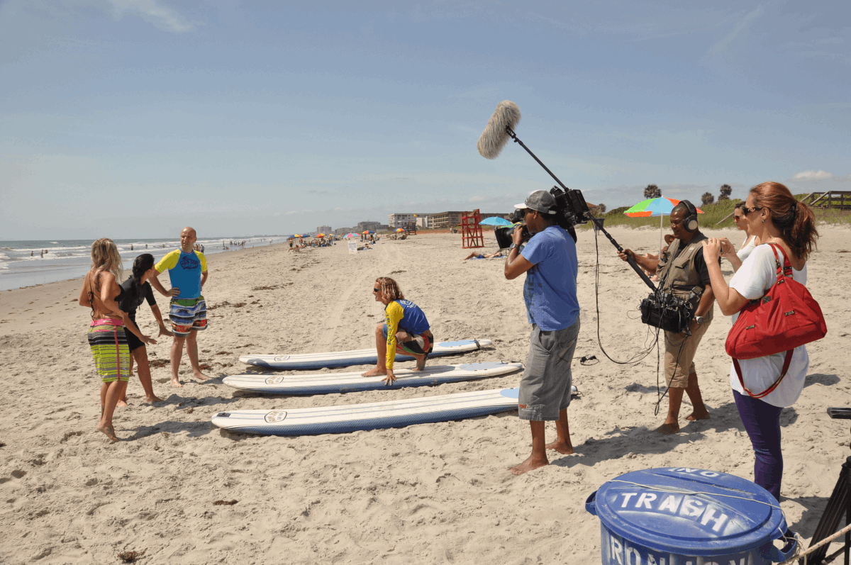 A crew films a surf lesson
