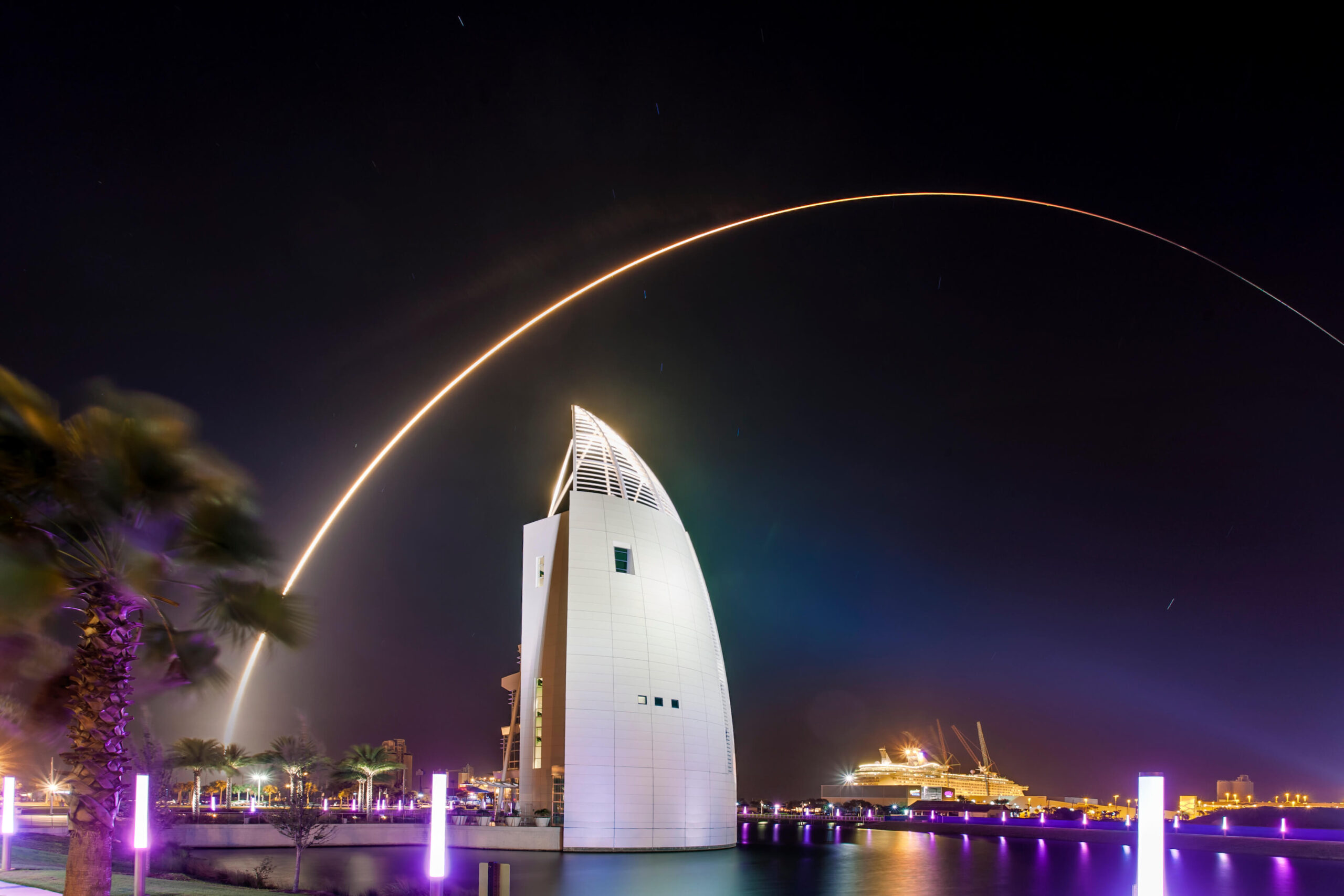 a long exposure of a night launch over Port Canaveral's Cove