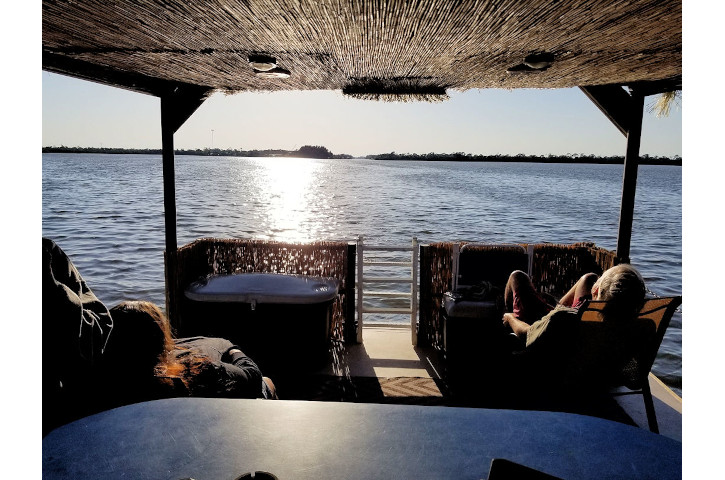 people enjoy sunset aboard the "Liki Tiki"