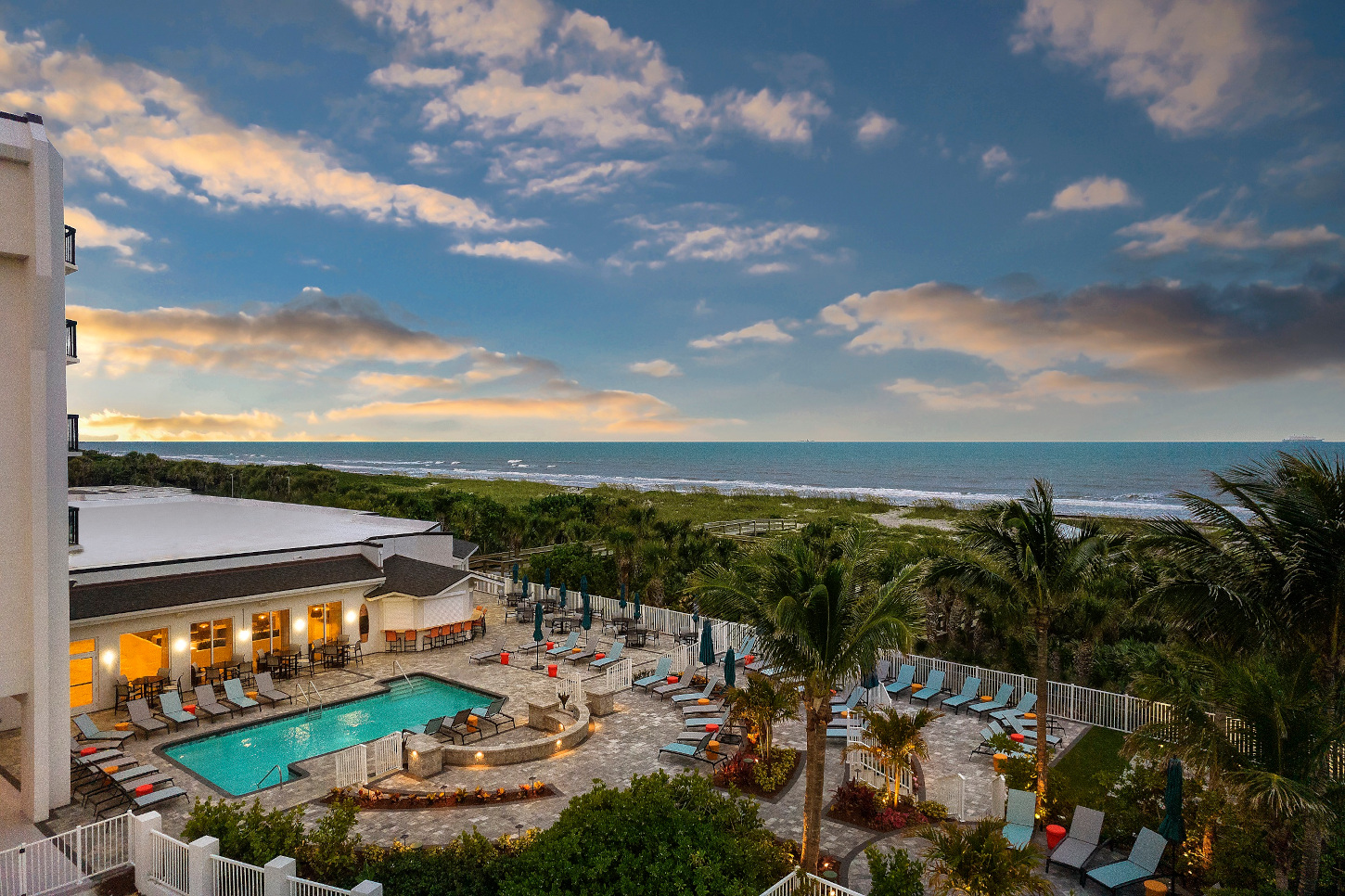 Hilton Garden Inn Cocoa Beach evening pool area view from balcony