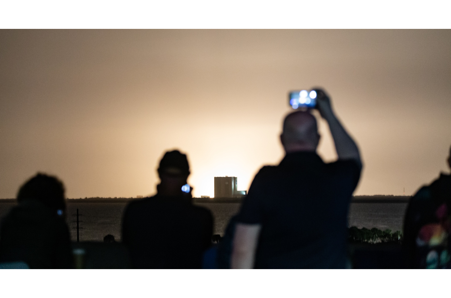 Guests view a launch at Kennedy Space Center from The Space Bar in Titusville