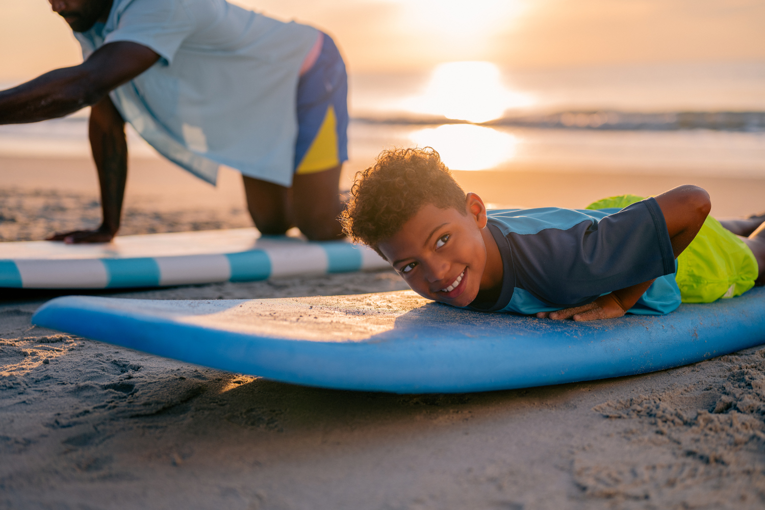 boy learning to surf