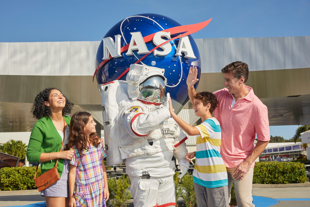 A family hangs out with Space Person at Kennedy Space Center Visitor Complex