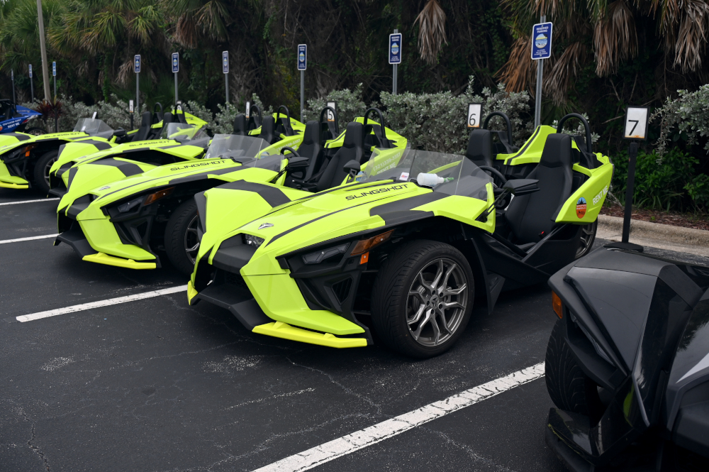 Slingshots sit in a parking lot