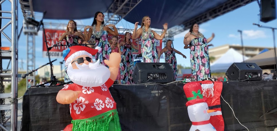 women perform at surfing santas