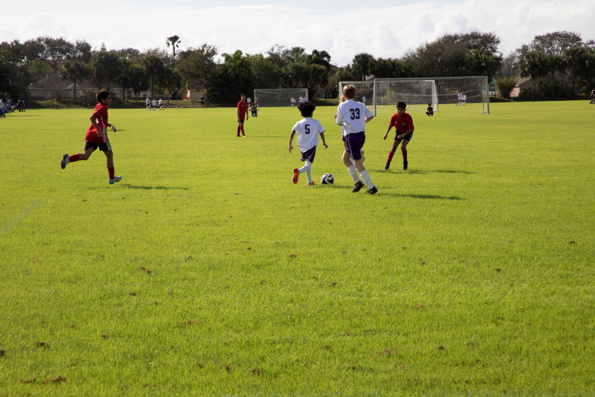 Kids play soccer at Mitchell Ellington Park