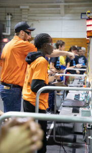 a student and mentor participate in a robotics competition at Florida Tech