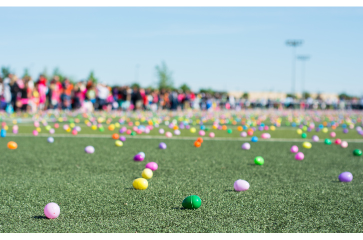 Easter egg hunt with plastic colored eggs